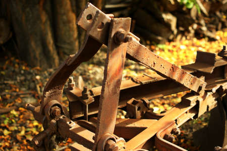 Rusty plow with big knife left on the farm Local historical landmark.の写真素材