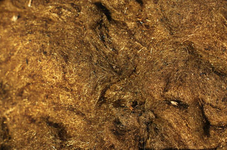 House roof renovation and repair with glass wool, fiberglass, thermal insuation. Roofer laying glass...