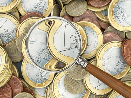 Euro coins with magnifying glass analyzingの写真素材