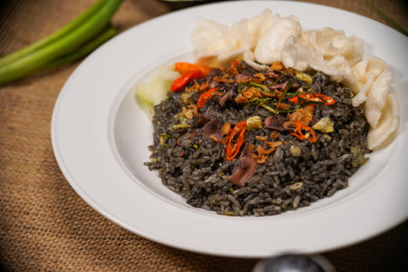 Close up of black rice with minced pork and pickled cucumber. squid fried riceの写真素材