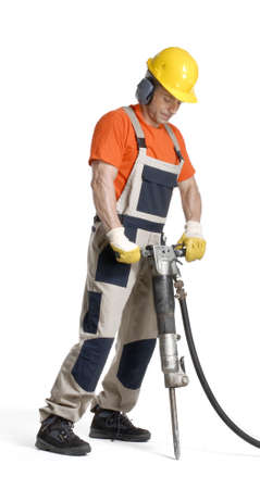 Construction worker drilling on white background の写真素材