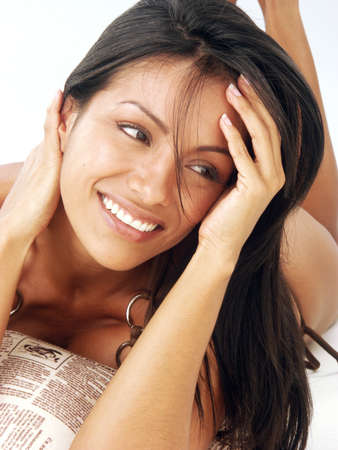 Beautiful young hispanic woman on white backgroundの写真素材