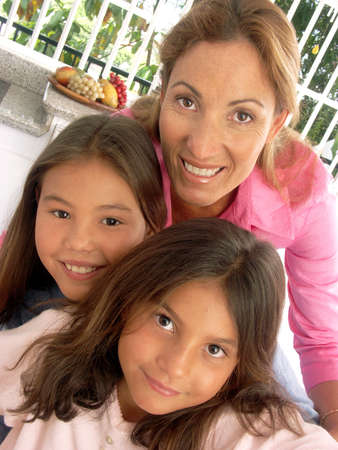 Mother and her children posing together