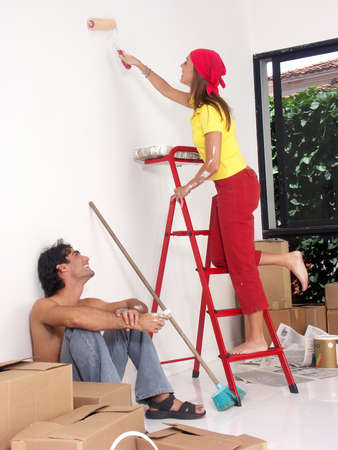 Hispanic couple working on their new home togetherの写真素材