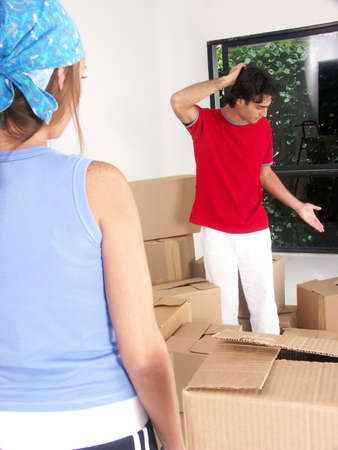 Hispanic couple working on their new home together