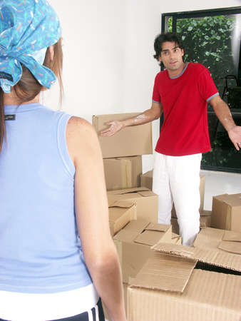 Hispanic couple working on their new home togetherの写真素材