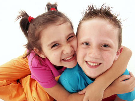 Two happy children on white backgroundの写真素材