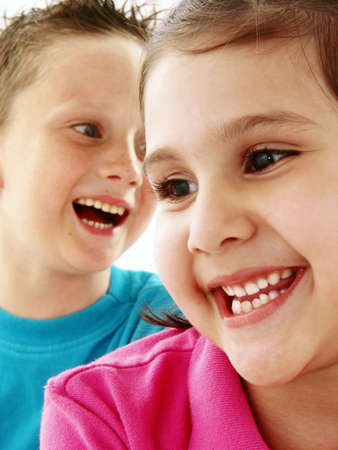 Two happy children on white backgroundの写真素材