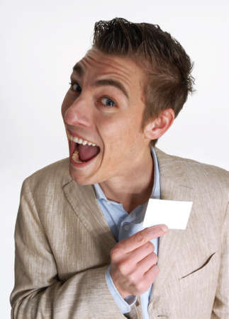 Young businessman holding business cardの写真素材