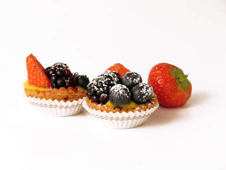 Berry tarts on white の写真素材