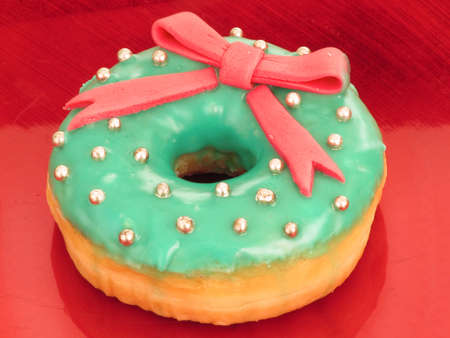 Doughnut with icing on a plateの写真素材