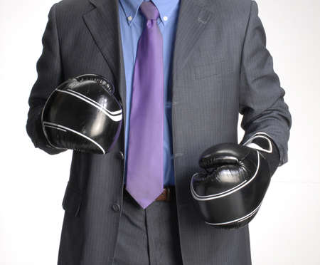 Man in suit with boxing glovesの写真素材
