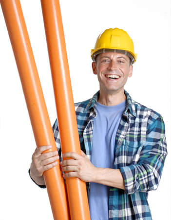 Construction worker holding building materialsの写真素材