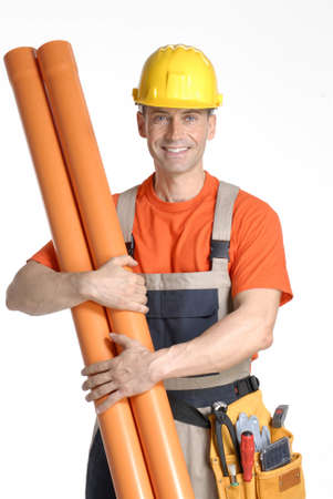 Construction worker holding building materialsの写真素材