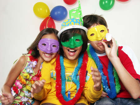 Three carnival kids having fun togetherの写真素材