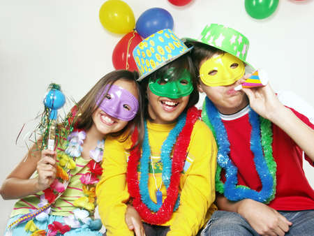 Three carnival kids having fun togetherの写真素材