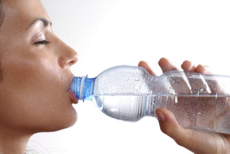 Woman drinking from water bottleの写真素材