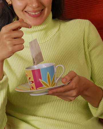 Beautiful woman with cup of tea
