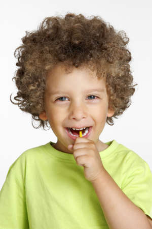 Afro kid having his lollipop