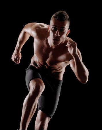 Portrait of a runner on white background の写真素材