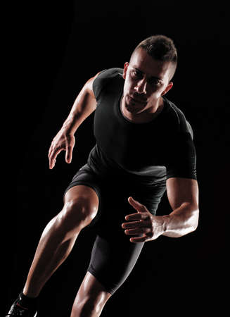 Portrait of a runner on white background の写真素材
