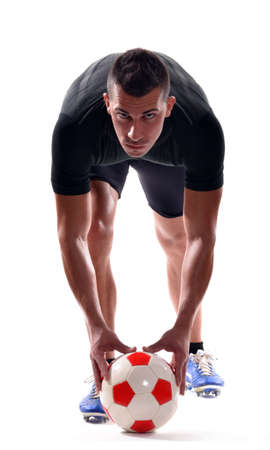 Soccer player training with a soccer ballの写真素材