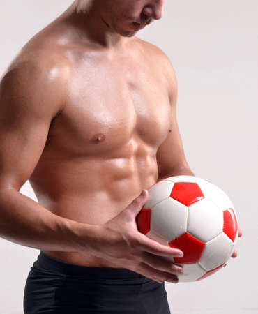 Soccer player training with a soccer ballの写真素材