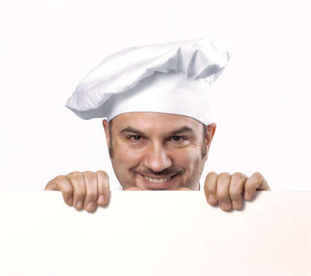 Chef is holding a white cardboardの写真素材