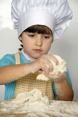 Little girl in the kitchenの写真素材
