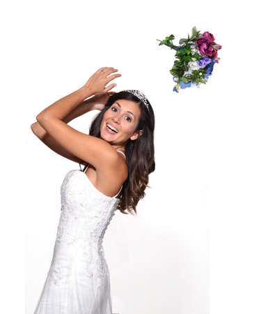 Bride throwing a bouquet of flowersの写真素材