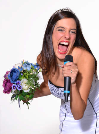 Bride holding flowers and singingの写真素材