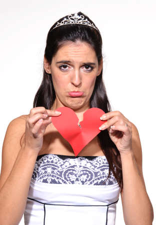 Bride holding a broken heartの写真素材