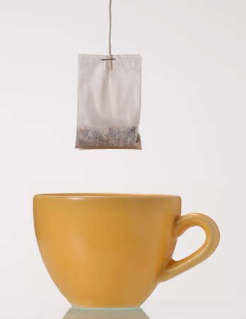 Teabag and a cup of teaの写真素材