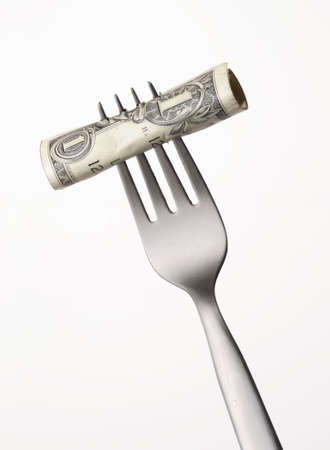 Fork with a dollar noteの写真素材