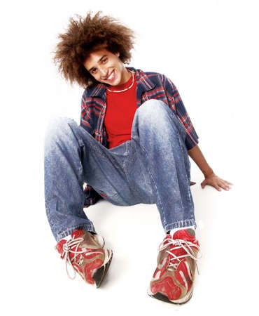 Young man with afro sittingの写真素材