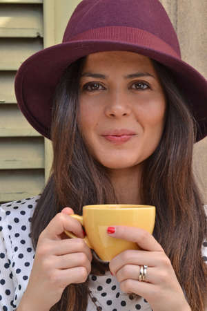 Caucasian woman with a cup of coffeeの写真素材