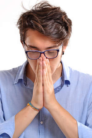 Man with glasses is prayingの写真素材