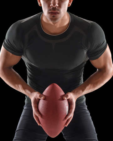 Athletic man holding rugby ballの写真素材