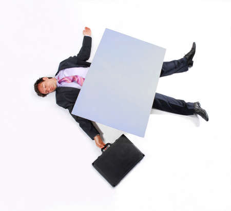 Businessman debt concept crushed by a big panel.の写真素材