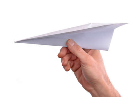 Hand throwing paper plane isolated on white background.の写真素材