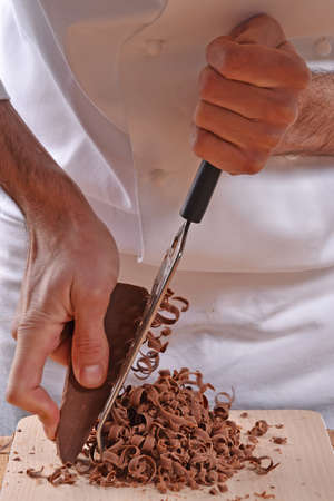Pastry chef hands preparing brownies