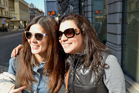 Two female friends in sunglasses