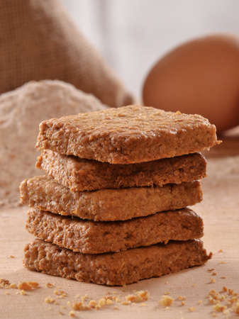 Heap of cereal bran cookies and ingredients background.の写真素材
