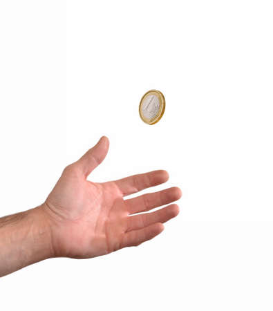 Hand holding coin on white backgroundの写真素材
