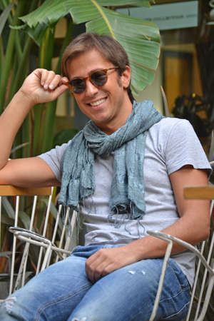 Man in sunglasses smiling at camera