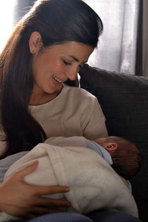 Mother holding her newborn baby