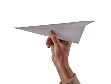Hand throwing paper plane isolated on white background.の写真素材