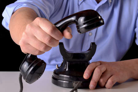 Answer the call, giving the handset.Answer phone. A call for you.