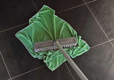 Mop with green ragの写真素材