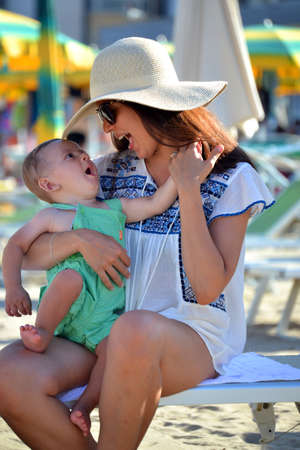 Young woman with her baby boyの写真素材